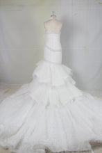 C2022-Vintea - halter fit-and-flare wedding gown with tiered ostrich feather train